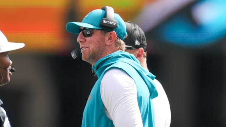 Sep 7, 2025; Jacksonville, Florida, USA;  Jacksonville Jaguars head coach Liam Coen talks with Referee Alex Moore during the first half of a game against the Carolina Panthers at EverBank Stadium. Mandatory Credit: Nathan Ray Seebeck-Imagn Images