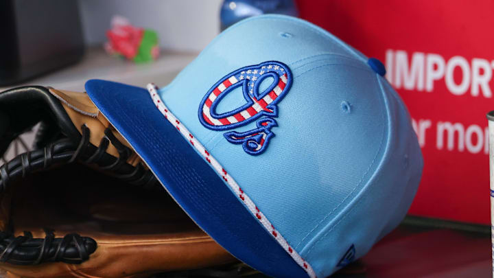 Jul 4, 2025; Atlanta, Georgia, USA; A detailed view of the Baltimore Orioles 4th of July hat in the dugout against the Atlanta Braves in the third inning at Truist Park. Jul 4, 2025; Atlanta, Georgia, USA; A detailed view of the Baltimore Orioles 4th of July hat in the dugout against the Atlanta Braves in the third inning at Truist Park.