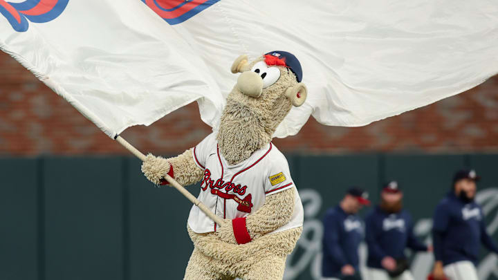 Sep 24, 2024; Atlanta, Georgia, USA; Atlanta Braves mascot Blooper waves a flag after a victory over the New York Mets at Truist Park. Mandatory Credit: Brett Davis-Imagn Images
