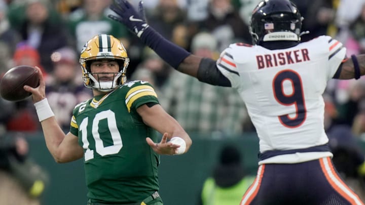 Green Bay Packers quarterback Jordan Love (10) throws a pass while pressured by Chicago Bears safety Jaquan Brisker (9) during the first quarter of their game Sunday, December 7, 2025 at Lambeau Field in Green Bay, Wisconsin.