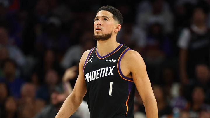 Apr 27, 2026; Phoenix, Arizona, USA; Phoenix Suns guard Devin Booker (1) reacts against Oklahoma City Thunder guard Shai Gilgeous-Alexander (2) in the second half during game four of the first round of the 2026 NBA Playoffs at Mortgage Matchup Center. Mandatory Credit: Mark J. Rebilas-Imagn Images