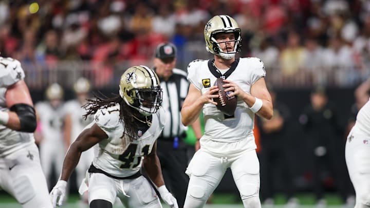 Sep 29, 2024; Atlanta, Georgia, USA; New Orleans Saints quarterback Derek Carr (4) drops back to pass against the Atlanta Falcons in the fourth quarter at Mercedes-Benz Stadium. Mandatory Credit: Brett Davis-Imagn Images
