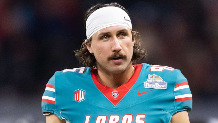 Dec 26, 2025; Phoenix, AZ, USA; New Mexico Lobos punter Daniel Hughes (96) against the Minnesota Golden Gophers during the Rate Bowl at Chase Field. Mandatory Credit: Mark J. Rebilas-Imagn Images