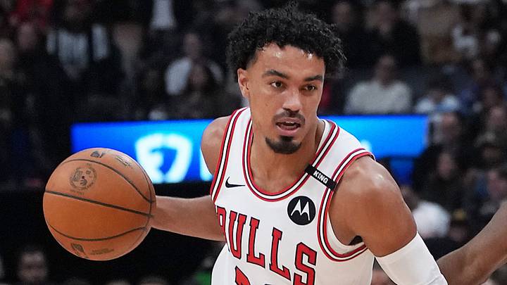 Oct 21, 2026; Toronto, Ontario, CAN;  Chicago Bulls guard Tre Jones (30) dribbles against Toronto Raptors guard Ja'kobe Walter (14) during the third quarter at Scotiabank Arena.  Mandatory Credit: Nick Turchiaro-Imagn Images