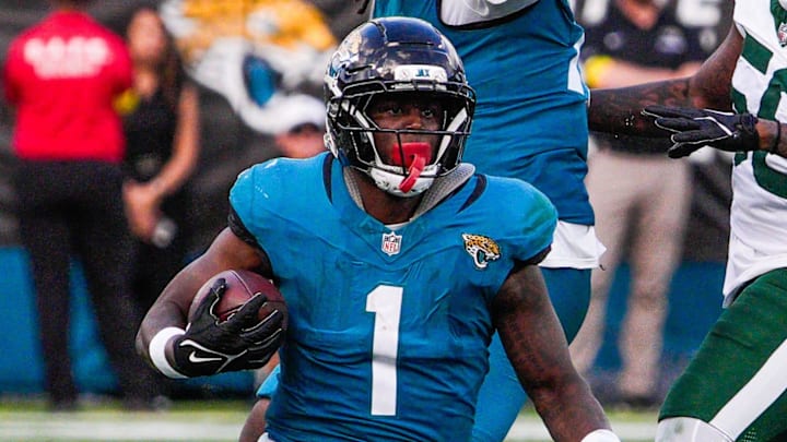 Jacksonville Jaguars running back Travis Etienne Jr. (1) run for a touchdown in the fourth quarter during an NFL football game at EverBank Stadium, Sunday, Dec. 14, 2025, in Jacksonville, Fla. The Jaguars defeated the Jets 48-20. [Doug Engle/Florida Times-Union]