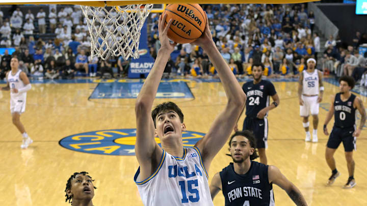 Feb 8, 2025; Los Angeles, California, USA;  UCLA Bruins center Aday Mara (15) drives to the basket past Penn State Nittany Lions forward Miles Goodman (8) and guard Freddie Dilione V (4) in the second half at Pauley Pavilion presented by Wescom. Mandatory Credit: Jayne Kamin-Oncea-Imagn Images
