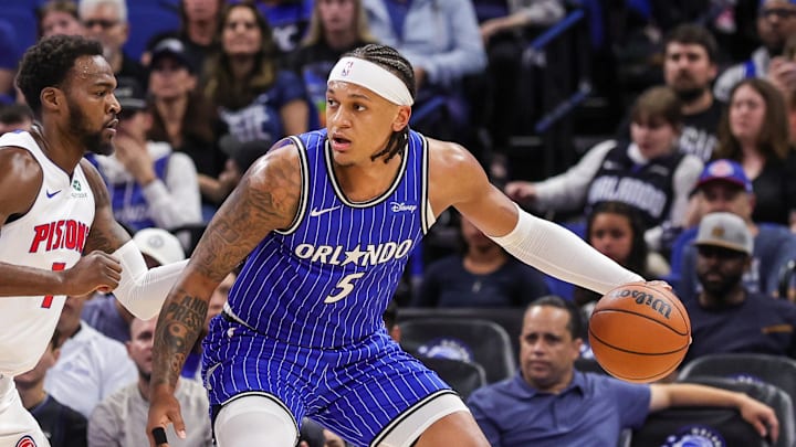 Apr 6, 2026; Orlando, Florida, USA; Orlando Magic forward Paolo Banchero (5) handles the ball in front of Detroit Pistons forward Paul Reed (7) during the first quarter at Kia Center. Mandatory Credit: Mike Watters-Imagn Images Apr 6, 2026; Orlando, Florida, USA; Orlando Magic forward Paolo Banchero (5) handles the ball in front of Detroit Pistons forward Paul Reed (7) during the first quarter at Kia Center. Mandatory Credit: Mike Watters-Imagn Images
