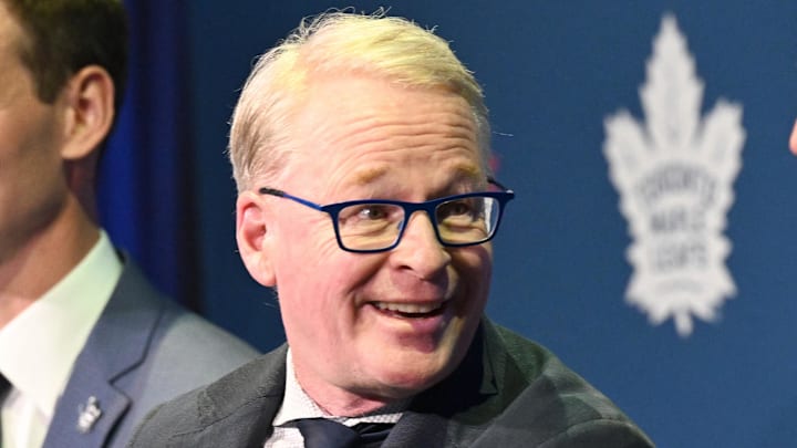 May 4, 2026; Toronto, Ontario, CANADA;  Maple Leafs Sports and Entertainment CEO Keith Pelley answers media questions between Toronto Maple Leafs general manager John Chayka (left) and senior executive advisor Mats Sundin during an introductory news conference at Real Sports Bar and Grill. Mandatory Credit: Dan Hamilton-Imagn Images