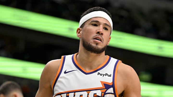 Nov 12, 2025; Dallas, Texas, USA; Phoenix Suns guard Devin Booker (1) reacts to making a basket against the Dallas Mavericks during the second half at the American Airlines Center. Mandatory Credit: Jerome Miron-Imagn Images