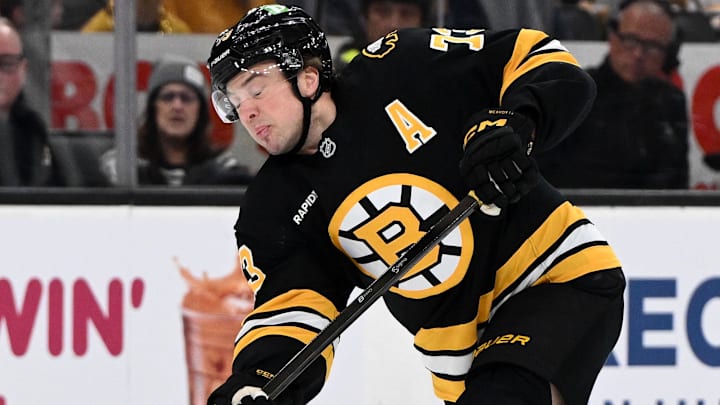 Apr 11, 2026; Boston, Massachusetts, USA; Boston Bruins defenseman Charlie McAvoy (73) attempts a shot against the Tampa Bay Lightning during the first period at the TD Garden. Mandatory Credit: Brian Fluharty-Imagn Images