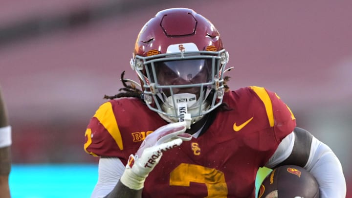 Sep 6, 2025; Los Angeles, California, USA; USC Trojans running back Waymond Jordan (2) Georgia Southern Eagles defensive back Ayden Jackson (5) and runs into the end zone for a touchdown during the second half at the Los Angeles Memorial Coliseum. Mandatory Credit: Jayne Kamin-Oncea-Imagn Images