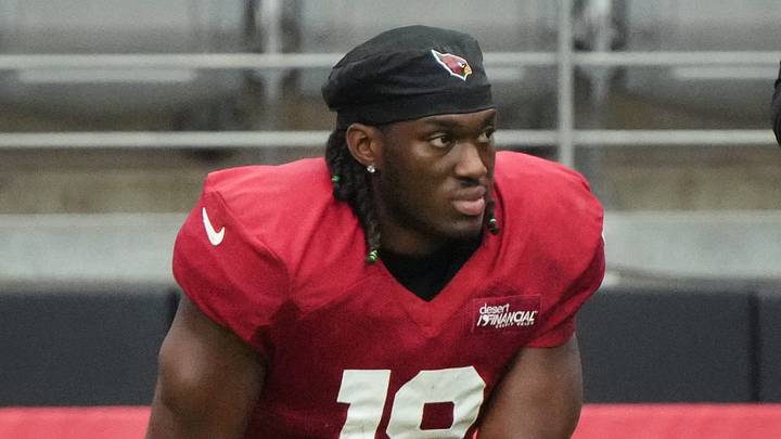 Arizona Cardinals receiver Marvin Harrison Jr. (18) watches from the sidelines during the team's practice at State Farm Stadium on July 29, 2025.