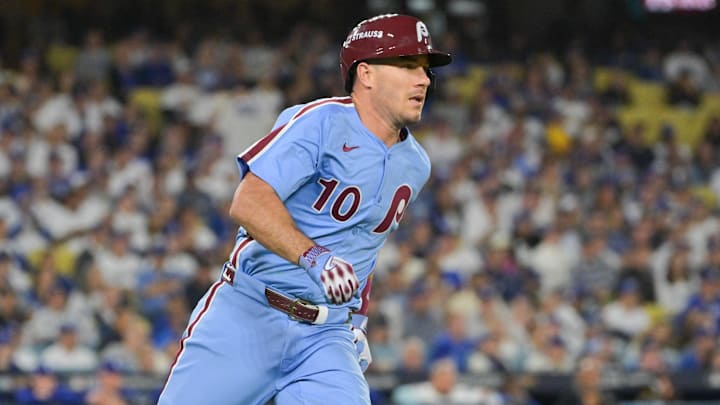 Oct 8, 2025; Los Angeles, California, USA; Philadelphia Phillies catcher J.T. Realmuto (10) rounds the bases after hitting a double during the fourth inning against the Los Angeles Dodgers during game three of the NLDS round for the 2025 MLB playoffs at Dodger Stadium. Mandatory Credit: Jayne Kamin-Oncea-Imagn Images