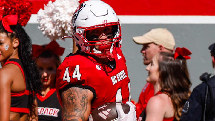 Oct 4, 2025; Raleigh, North Carolina, USA;  NC State Wolfpack tight end Cody Hardy (44) makes a touchdown during the first half of the game against Campbell Fighting Camels at Carter-Finley Stadium. Mandatory Credit: Jaylynn Nash-Imagn Images