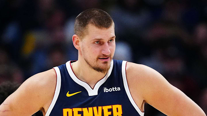 Dec 15, 2025; Denver, Colorado, USA; Denver Nuggets center Nikola Jokic (15) reacts in the second quarter against the Houston Rockets at Ball Arena. Mandatory Credit: Ron Chenoy-Imagn Images