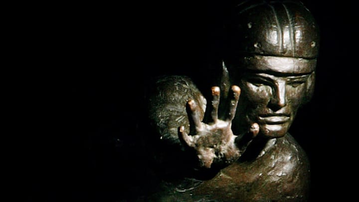 Ohio State's quarterback Troy Smith poses at the Woody Hayes Facility with a Heisman Trophy on Dec. 3, 2006.