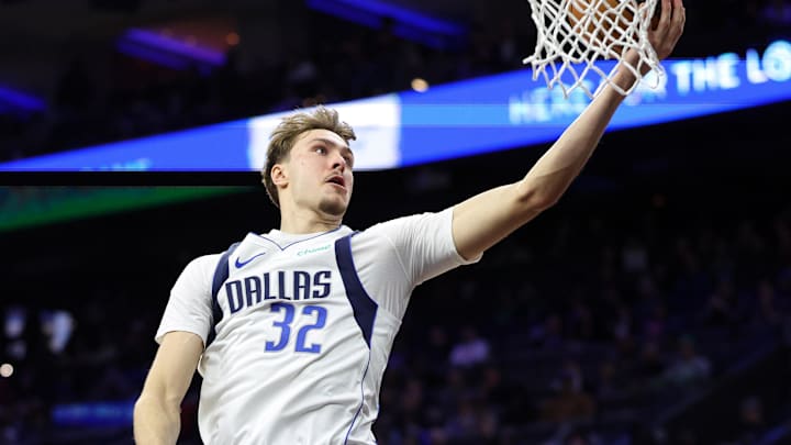 Dec 20, 2025; Philadelphia, Pennsylvania, USA; Dallas Mavericks forward Cooper Flagg (32) drives for a score against the Philadelphia 76ers during the second quarter at Xfinity Mobile Arena. Mandatory Credit: Bill Streicher-Imagn Images