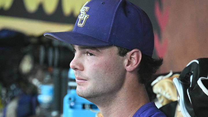 Jun 21, 2025; Omaha, Neb, USA; LSU Tigers starting pitcher Kade Anderson (32) sits in the dugout between the eighth and ninth innings against the Coastal Carolina Chanticleers at Charles Schwab Field. Mandatory Credit: Steven Branscombe-Imagn Images Jun 21, 2025; Omaha, Neb, USA; LSU Tigers starting pitcher Kade Anderson (32) sits in the dugout between the eighth and ninth innings against the Coastal Carolina Chanticleers at Charles Schwab Field. Mandatory Credit: Steven Branscombe-Imagn Images