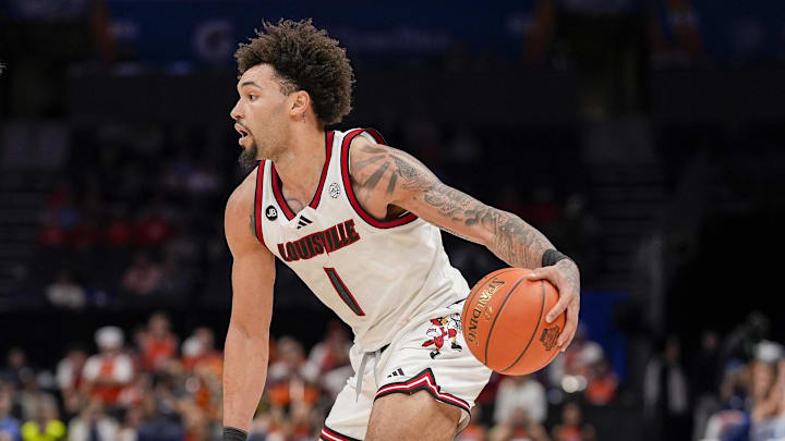 Mar 14, 2025; Charlotte, NC, USA; Louisville Cardinals guard J'Vonne Hadley (1) handles the ball against Clemson Tigers forward Ian Schieffelin (4) during the second half at Spectrum Center. Mandatory Credit: Jim Dedmon-Imagn Images Mar 14, 2025; Charlotte, NC, USA; Louisville Cardinals guard J'Vonne Hadley (1) handles the ball against Clemson Tigers forward Ian Schieffelin (4) during the second half at Spectrum Center. Mandatory Credit: Jim Dedmon-Imagn Images