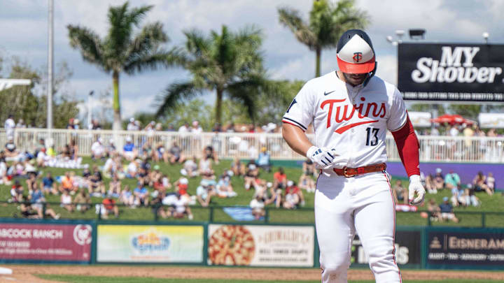 Feb 25, 2025; Fort Myers, Florida, USA; Minnesota Twins first baseman  Ty France (13) tags home plate after hitting a home run against the New York Yankees in the third inning at Lee Health Sports Complex.