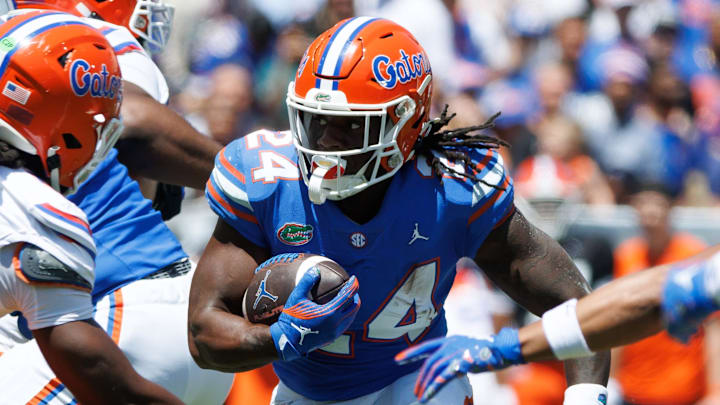 Apr 12, 2025; Gainesville, FL, USA; Florida Gators running back Ja'Kobi Jackson (24) runs with the ball during the first half at Ben Hill Griffin Stadium. Mandatory Credit: Matt Pendleton-Imagn Images