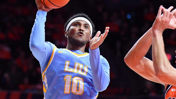Nov 22, 2025; Champaign, Illinois, USA;  Long Island University Sharks guard A.J. Neal, Jr. (10) drives to the basket as Illinois Fighting Illini guard Andrej Stojakovic (2) defends during the second half at State Farm Center. Mandatory Credit: Ron Johnson-Imagn Images