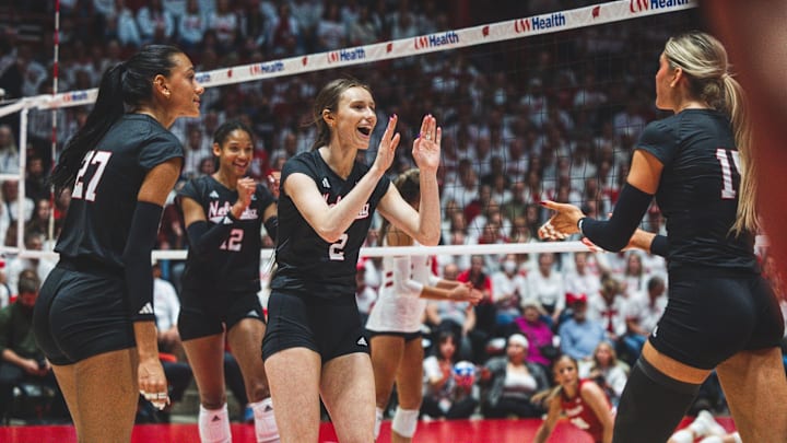Nebraska volleyball players celebrate a point at Wisconsin. Nebraska volleyball players celebrate a point at Wisconsin.