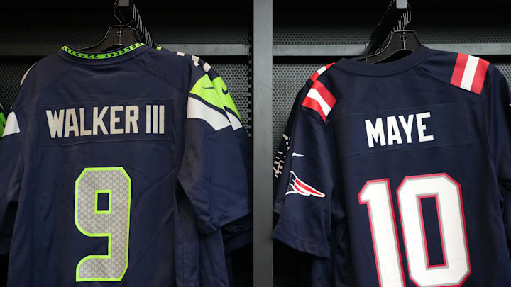 Jerseys of Seattle Seahawks RB Kenneth Walker III and New England Patriots QB Drake Maye at the Super Bowl LX Experience.