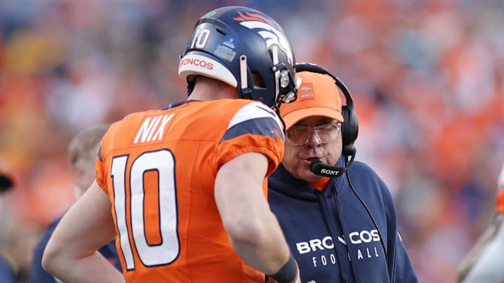 Dec 14, 2025; Denver, Colorado, USA; Denver Broncos head coach Sean Payton talks with quarterback Bo Nix (10) during the second quarter against the Green Bay Packers at Empower Field at Mile High. 