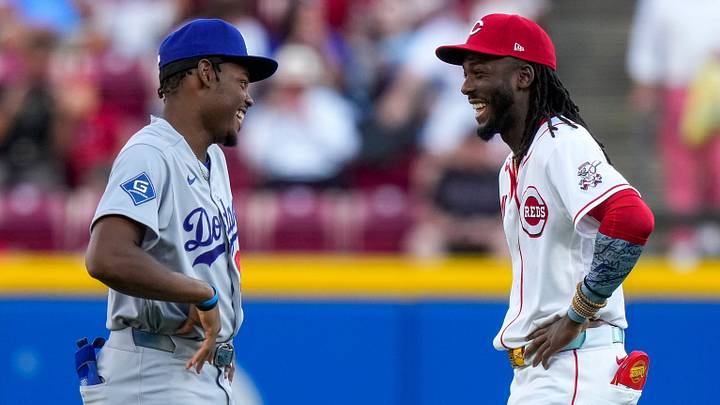 Los Angeles Dodgers right fielder Josue de Paula (95) and Cincinnati Reds shortstop Elly De La Cruz (44) chat