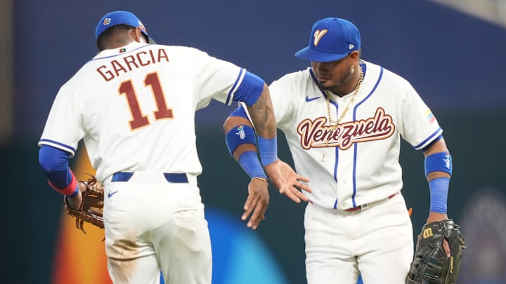 Venezuela’s Maikel Garcia, left, and Luis Arráez celebrate Friday’s win over the Netherlands.