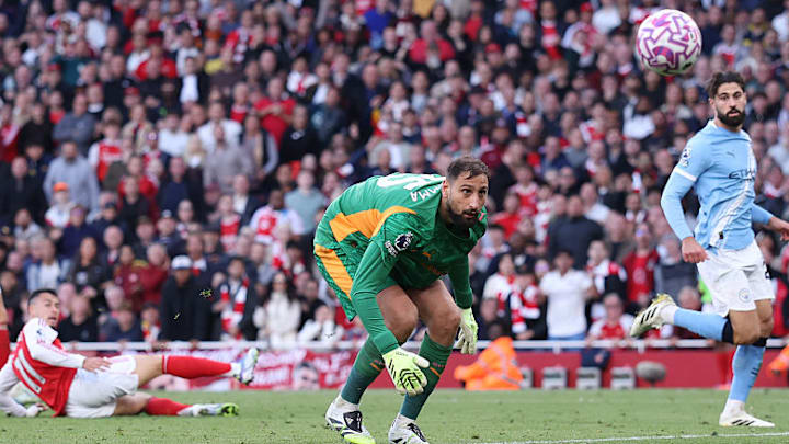 Gabriel Martinelli lobbed Gianluigi Donnarumma in stoppage time to earn Arsenal a point.