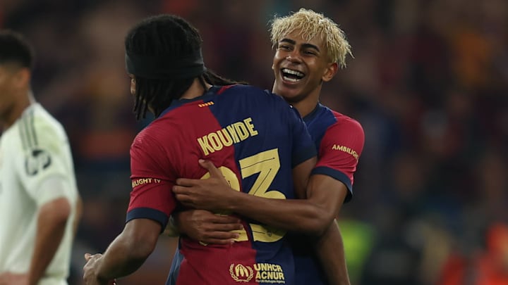 Jules Koundé (left) and Lamine Yamal celebrate Barcelona's game-winning goal in the Copa Del Rey Final.