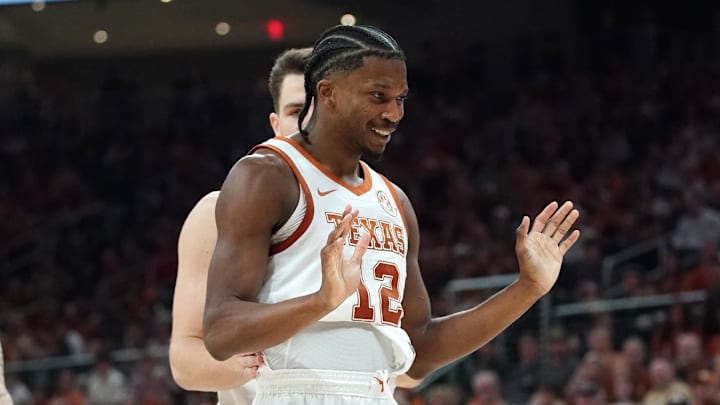 Texas Longhorns guard Tramon Mark (12) is talked down by forward Camden Heide (5) after an altercation with Texas A&M Aggies forward Rashaun Agee (12) during the first half at Moody Center.