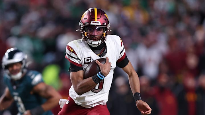 Washington Commanders quarterback Jayden Daniels (5) runs with the ball against the Philadelphia Eagles.