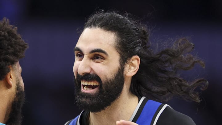 Orlando Magic center Goga Bitadze reacts after being dunked on by Charlotte Hornets forward Miles Bridges.