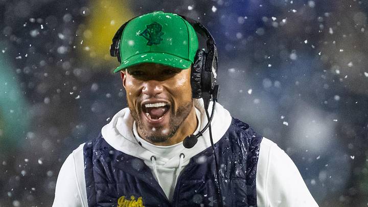 Nov 8, 2025; South Bend, Indiana, USA; Notre Dame Fighting Irish head coach Marcus Freeman celebrates with running back Aneyas Williams (22) after he scored a touchdown against the Navy Midshipmen during the second half at Notre Dame Stadium. 