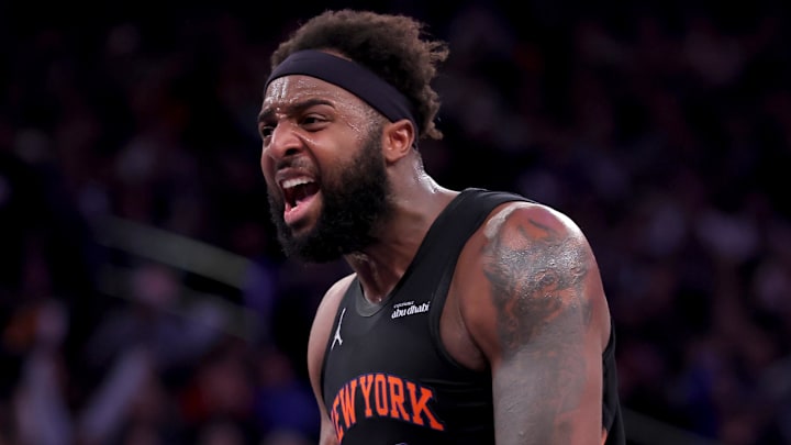 Dec 19, 2025; New York, New York, USA; New York Knicks center Mitchell Robinson (23) reacts after a dunk against the Philadelphia 76ers during the second quarter at Madison Square Garden. Mandatory Credit: Brad Penner-Imagn Images