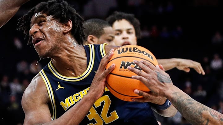 Michigan forward Tarris Reed Jr. (32) goes to the basket
