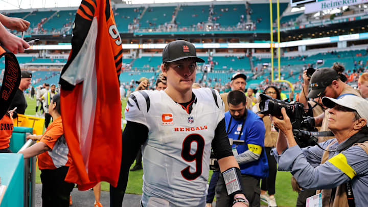 Dec 21, 2025; Miami Gardens, Florida, USA; Fans wave jerseys as Cincinnati Bengals quarterback Joe Burrow (9) enters the tunnel after the game against the Miami Dolphins at Hard Rock Stadium. Mandatory Credit: Sam Navarro-Imagn Images