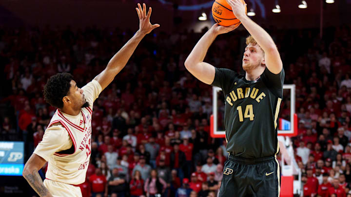 Purdue Boilermakers guard Jack Benter shoots a three-point shot against Nebraska Cornhuskers guard Jamarques Lawrence.