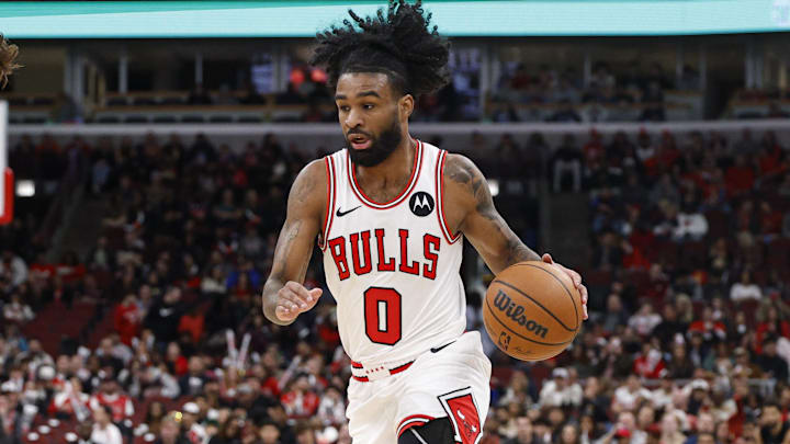 Nov 22, 2025; Chicago, Illinois, USA; Chicago Bulls guard Coby White (0) drives to the basket against Washington Wizards forward Corey Kispert (24) during the first half at United Center. Mandatory Credit: Kamil Krzaczynski-Imagn Images