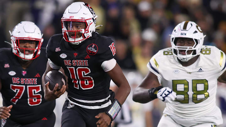 Nov 21, 2024; Atlanta, Georgia, USA; North Carolina State Wolfpack quarterback CJ Bailey (16) runs for a touchdown against the Georgia Tech Yellow Jackets in the fourth quarter at Bobby Dodd Stadium at Hyundai Field. Mandatory Credit: Brett Davis-Imagn Images Nov 21, 2024; Atlanta, Georgia, USA; North Carolina State Wolfpack quarterback CJ Bailey (16) runs for a touchdown against the Georgia Tech Yellow Jackets in the fourth quarter at Bobby Dodd Stadium at Hyundai Field. Mandatory Credit: Brett Davis-Imagn Images