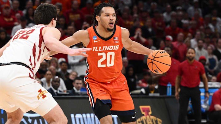 Mar 28, 2024; Boston, MA, USA; Illinois Fighting Illini forward Ty Rodgers (20) dribbles the ball against Iowa State Cyclones forward Milan Momcilovic (22) in the semifinals of the East Regional of the 2024 NCAA Tournament at TD Garden. Mandatory Credit: Brian Fluharty-Imagn Images