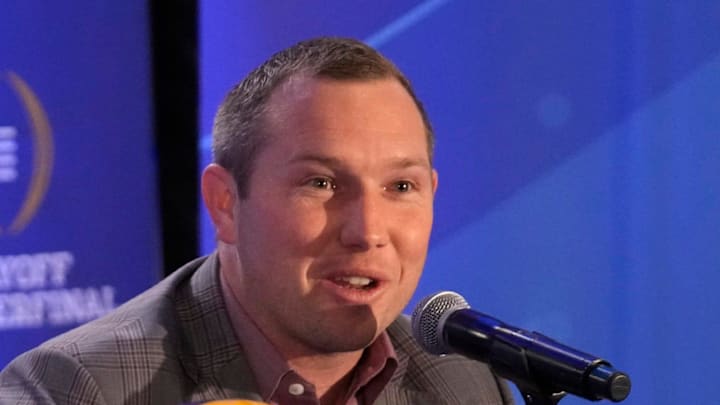 Arizona State head coach Kenny Dillingham responds to a question during a joint news conference with Texas head coach Steve Sarkisian before facing off in the Chick-fil-A Peach Bowl.