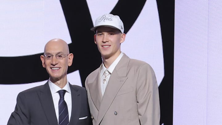 Jun 25, 2025; Brooklyn, NY, USA;  Egor Demin stands with NBA commissioner Adam Silver after being selected as the eighth pick by the Brooklyn Nets in the first round of the 2025 NBA Draft at Barclays Center. Mandatory Credit: Brad Penner-Imagn Images
