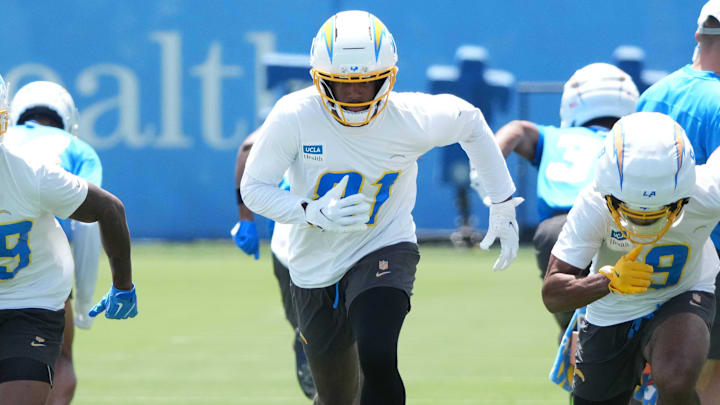 May 27, 2025; El Segundo, CA, USA; Los Angeles Chargers receivers Jaylen Johnson (39), Mike Williams (81) and receiver Tre Harris (9) during organized team activities at The Bolt. Mandatory Credit: Kirby Lee-Imagn Images