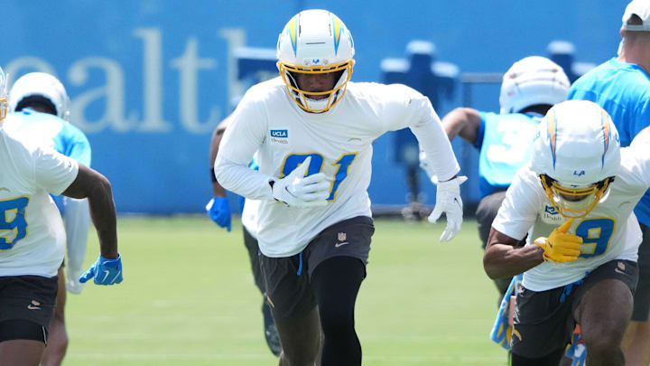 May 27, 2025; El Segundo, CA, USA; Los Angeles Chargers receivers Jaylen Johnson (39), Mike Williams (81) and receiver Tre Harris (9) during organized team activities at The Bolt. Mandatory Credit: Kirby Lee-Imagn Images