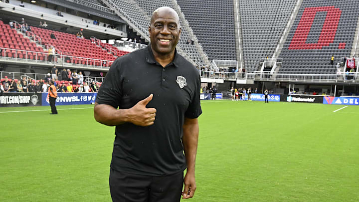 Washington Commanders owner Magic Johnson poses for a photo after the game between the Washington Spirit and Portland Thorns FC at Audi Field. Mandatory Credit: Brad Mills-Imagn Images Washington Commanders owner Magic Johnson poses for a photo after the game between the Washington Spirit and Portland Thorns FC at Audi Field. Mandatory Credit: Brad Mills-Imagn Images