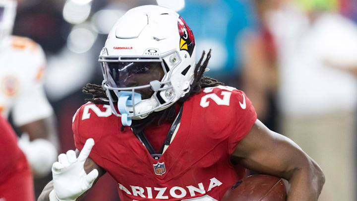 Aug 9, 2025; Glendale, Arizona, USA; Arizona Cardinals running back Michael Carter (22) against the Kansas City Chiefs during a preseason NFL game at State Farm Stadium. Mandatory Credit: Mark J. Rebilas-Imagn Images